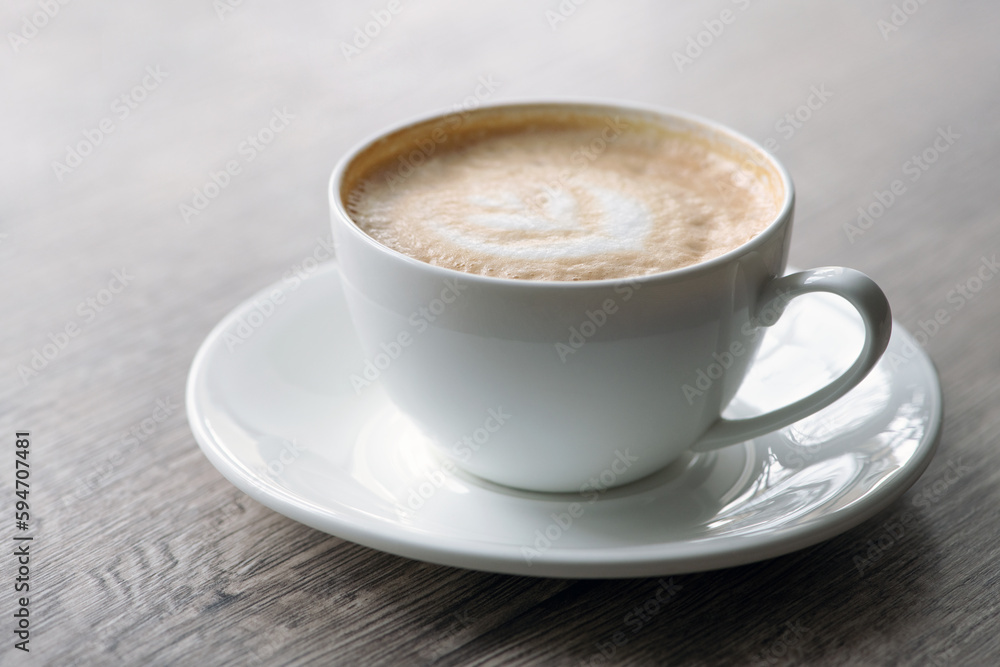 Cup of hot cappuccino coffee on table Cup of hot cappuccino coffee on table