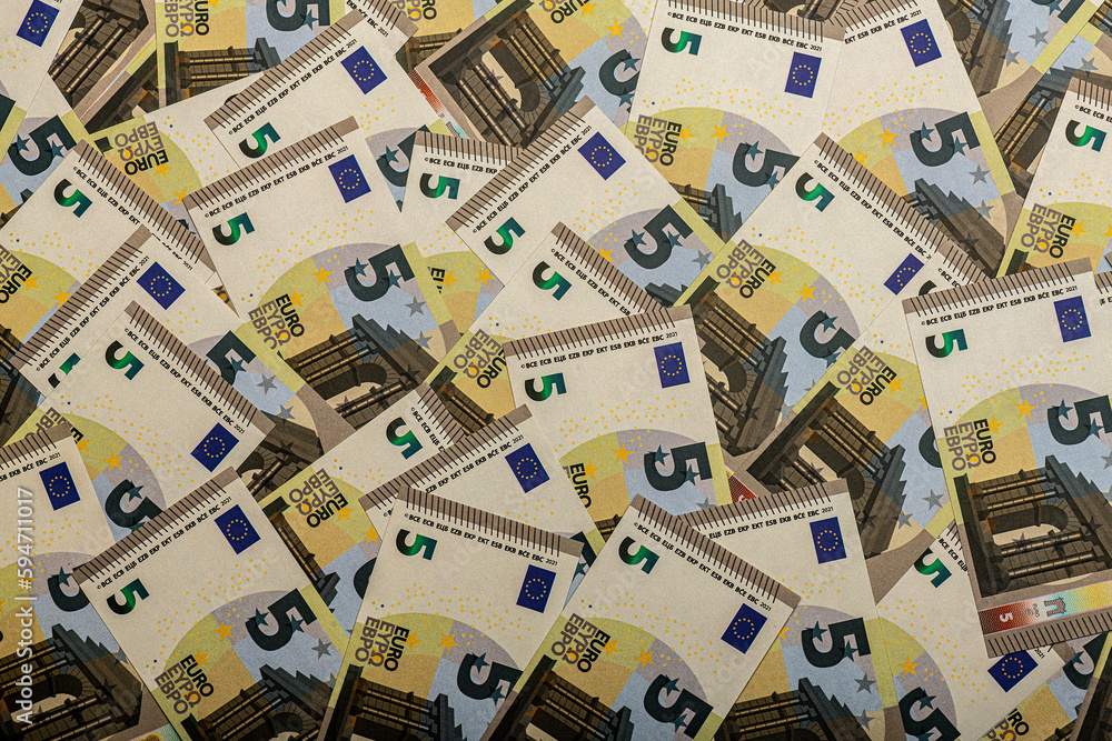 a heap of 5 euro banknotes a heap of 5 euro banknotes