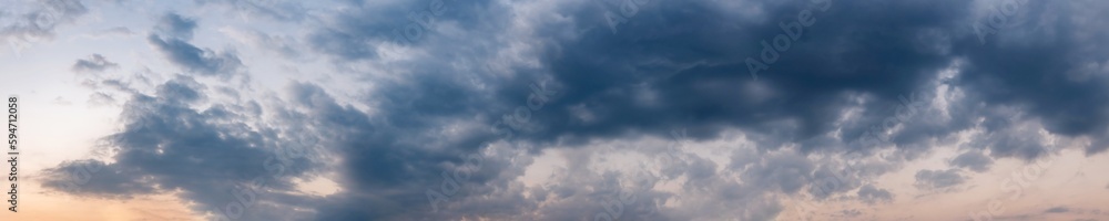Dramatic panorama sky with storm cloud on a cloudy day. Panoramic image. Dramatic panorama sky with storm cloud on a cloudy day. Panoramic image.