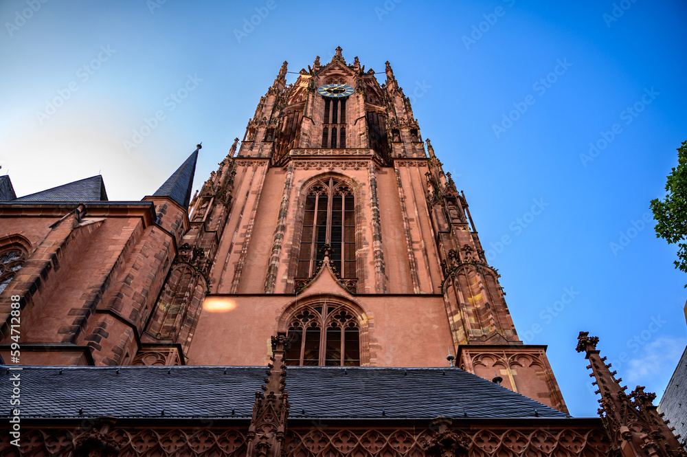 A bottom-up view of Frankfurt Cathedral (Bau Frankfurt) Bath St. Bartholomew in the morning light. It is a Roman Catholic Church. This is an old church located in the heart of Frankfurt.