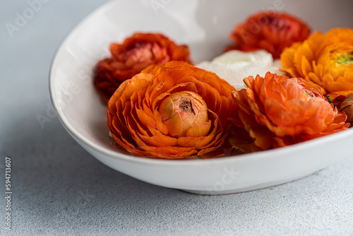 Interior decoration with bowl full of Ranunculus
