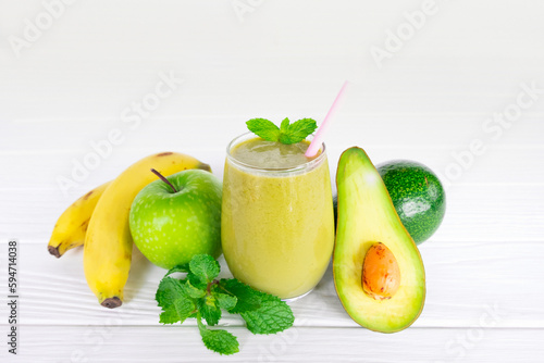 Avocado fresh cocktail smoothies fruit juice beverage healthy the taste yummy in glass drink episode good morning on white wooden background.
