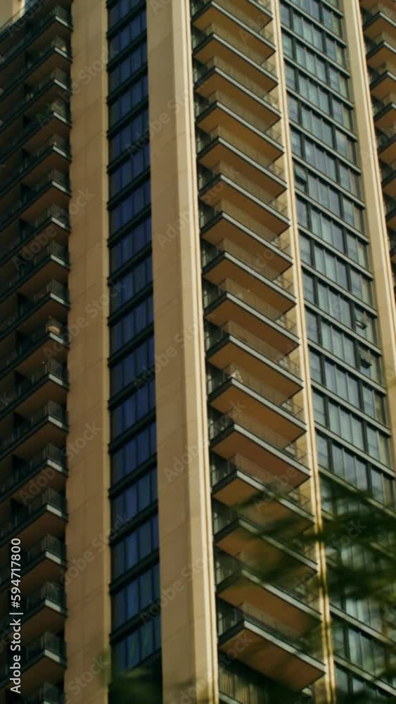 Video from a car window, a view of the windows of modern skyscrapers of a densely populated city Video from a car window, a view of the windows of modern skyscrapers of a densely populated city
