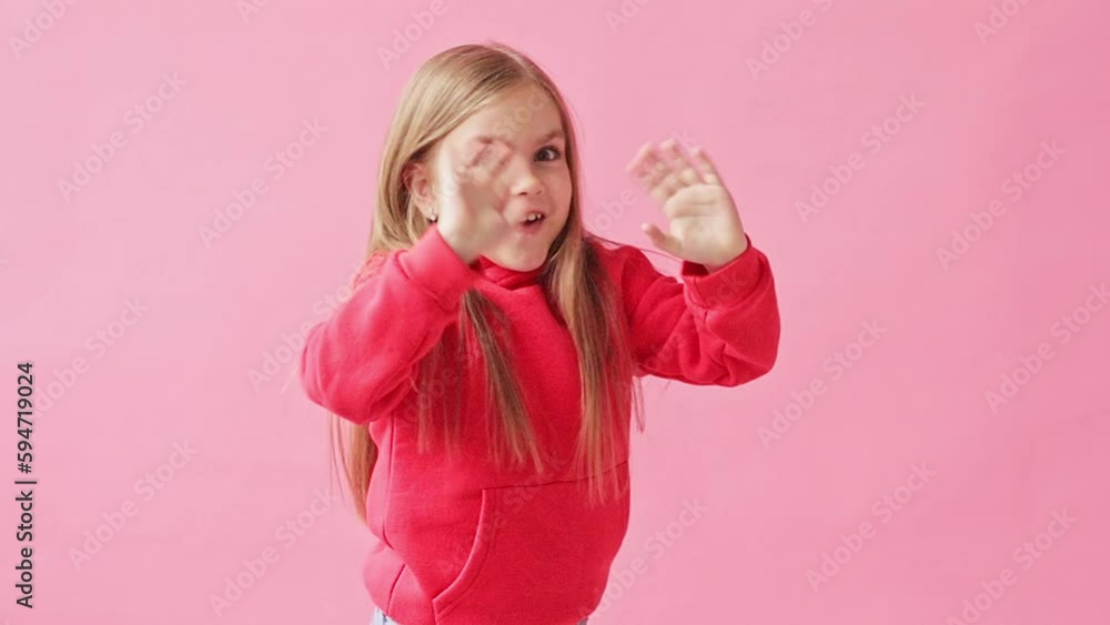 portrait of a girl in a red jacket , pink background portrait of a girl in a red jacket , pink background