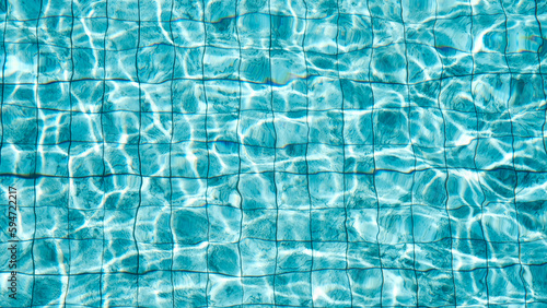 Reflection blue wave on swimming pool, Water swimming pool texture background, The sun reflection on swimming pool, Ripple pattern