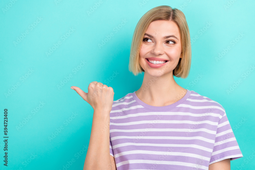 Photo of funny girl with bob hairstyle dressed striped t-shirt look directing empty space discount isolated on turquoise color background Photo of funny girl with bob hairstyle dressed striped t-shirt look directing empty space discount isolated on turquoise color background