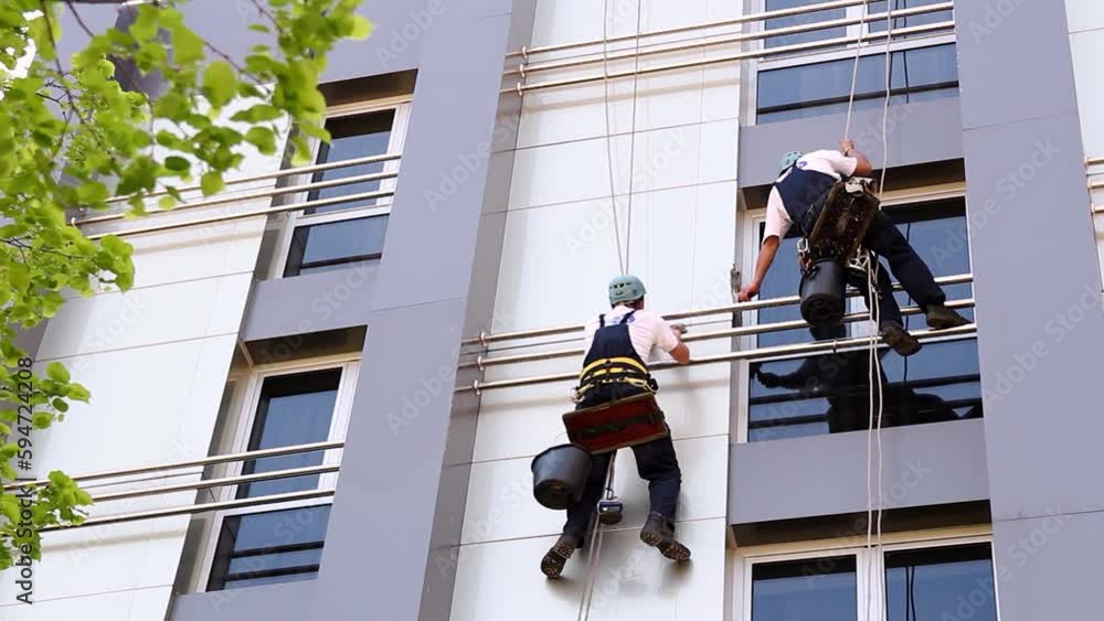 Curated visual reference: High Rise Building Instant Definition Hazards Reference: Two Cleaning Service Industrial Climbers Wash The Facade Of A
