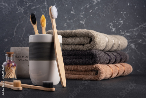 Bathroom towels and bamboo toothbrushes.