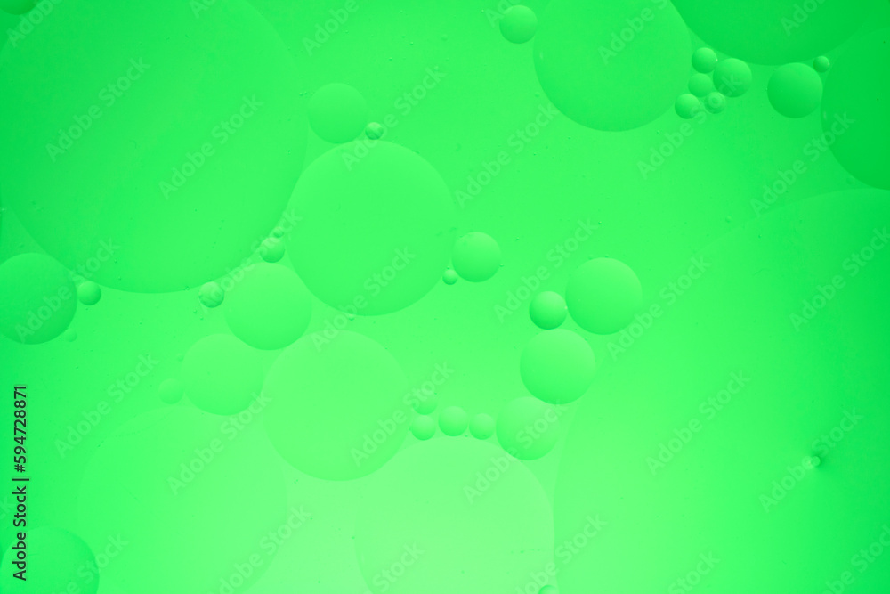 Abstract background with green oil circles on the water. Abstract background with green oil circles on the water.