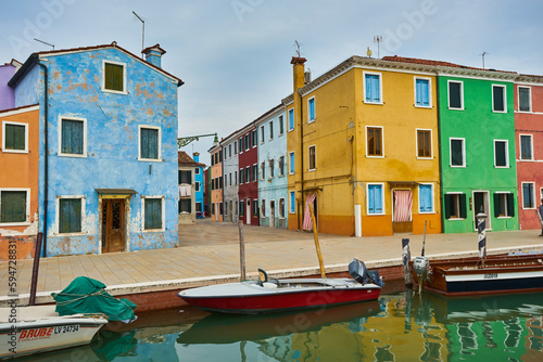 Colorful houses on the canal in Burano island, Venice, Italy.