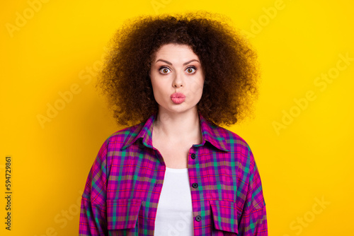 Photo of sweet impressed lady wear checkered jacket sending you kiss isolated yellow color background