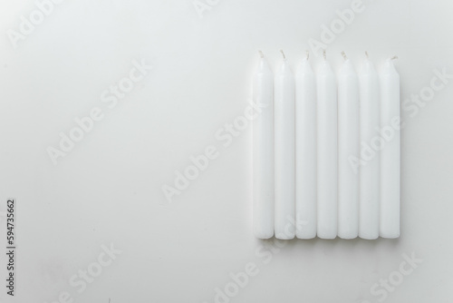 Wallpaper Mural top view white candles on the white background fire lamp flame death funeral Torontodigital.ca