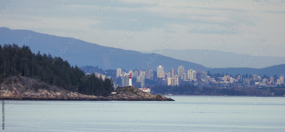 Lighthouse Park and City with Mountains in Background. Sunset. West Vancouver, British Columbia, Canada.