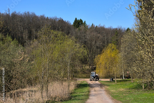 tractor on the paths of the old forest park