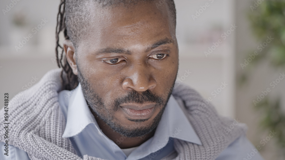 Tired male freelancer looking at computer screen, working long hours, burnout Tired male freelancer looking at computer screen, working long hours, burnout