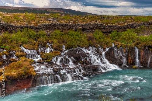Hraunfossar is a waterfall located in western Iceland  on the Hvit   river 