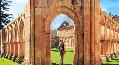 Woman tourist at San Juan cloister ruins at Soria in Castilla Spain- Travel in Europa photo