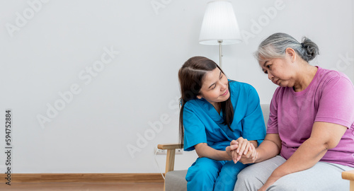 Photos Asian woman doctor take care and encourage elderly patien, which she is saddened from depression, to elderly and  health care concept