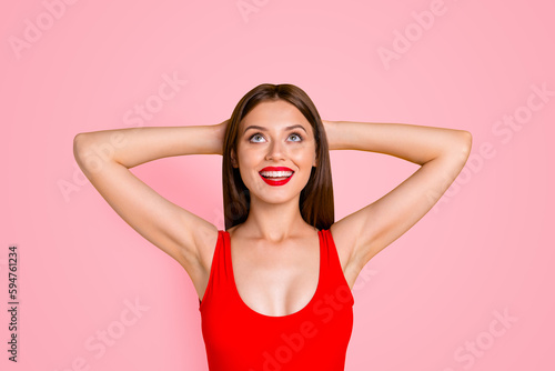 Enjoy your life Close up photo portrait of beautiful cheerful lovely attractive with decollete cleavage lady keeping holding hands behind head planning imagine resort isolated bright vivid background