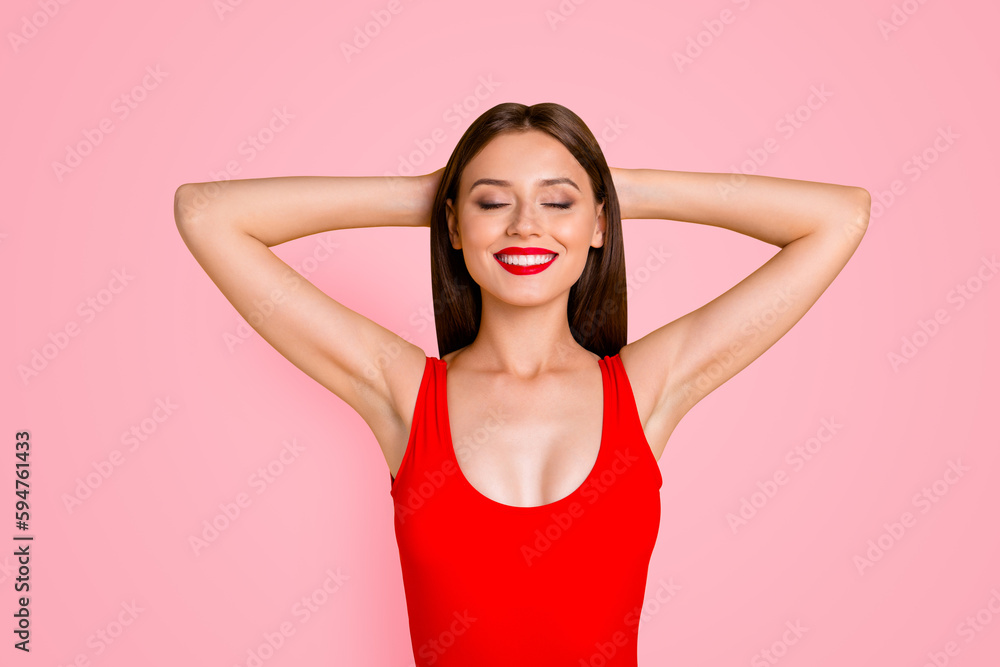 Time to rest from work on summer holiday Close up portrait of girl who dreams about vacation holding her hands behind her head isolated on vivid yellow background Time to rest from work on summer holiday Close up portrait of girl who dreams about vacation holding her hands behind her head isolated on vivid yellow background