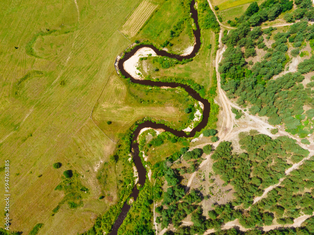 The meandering river between the forest and Steppe. Sluch river in Ukraine.