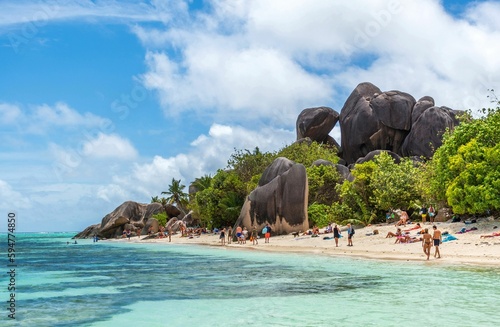 Beautiful tropical beach landscape with palm trees and amazing rock formations