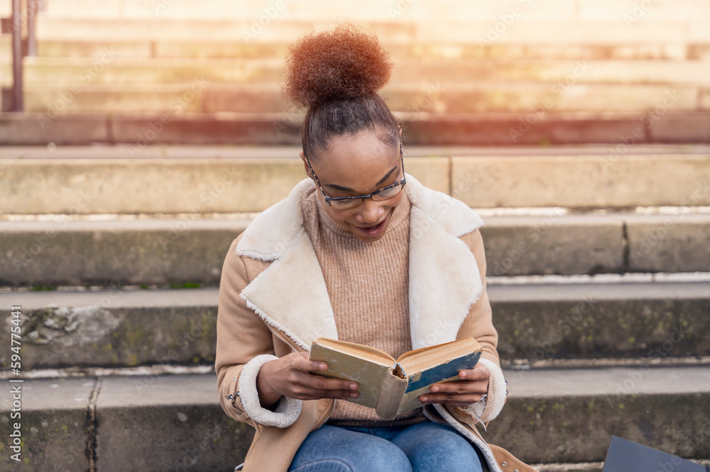 woman student reading a book, making a plan on stairs in city concept of studying hard Lifestyle photo woman student reading a book, making a plan on stairs in city concept of studying hard Lifestyle photo