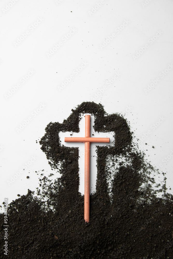 top view stick cross with dark soil on white desk funeral death grim reaper