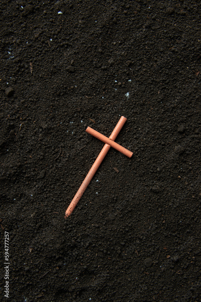 top view of cross on soil funeral devil death