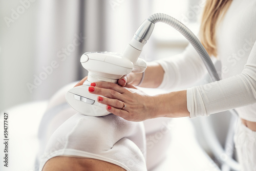 LPG enedermology equipment used for skin beautification of a female client in the cosmetics studio photo