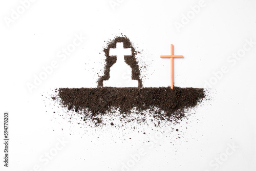 top view of cross shape with dark soil on the white surface grim reaper death funeral
