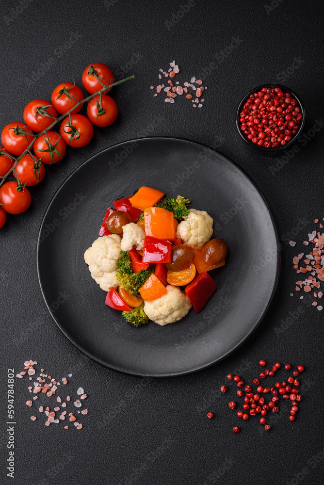 Delicious salad of fresh cherry tomatoes, sweet peppers, broccoli and cauliflower Delicious salad of fresh cherry tomatoes, sweet peppers, broccoli and cauliflower