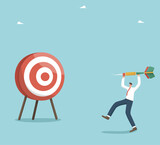 Motivation and determination on the path of great success, accuracy in setting goals and focus on achieving them, strategic planning in solving business problems, a man throws a dart right on target.