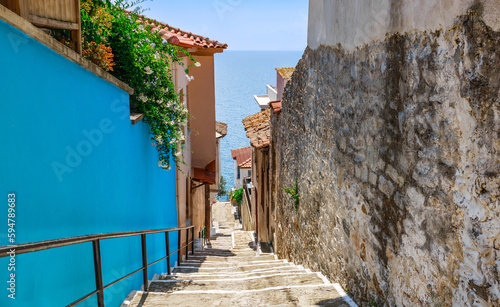 Fototapeta Naklejka Na Ścianę i Meble -  Narrow street and sea in old town Kavala, Macedonia, Greece, Europe