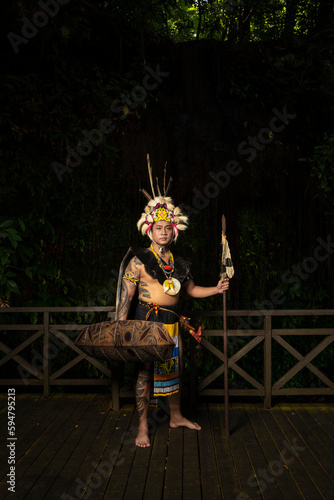 A Borneo man showcasing the beauty of her culture through stunning traditional clothing