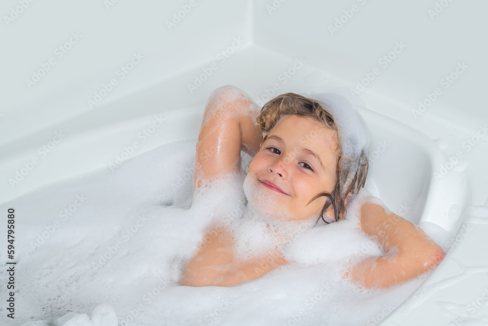 Child bathes in a bath with foam. Washing hair, kids shampoo. Foam on child head. Child bathes in a bath with foam. Washing hair, kids shampoo. Foam on child head.