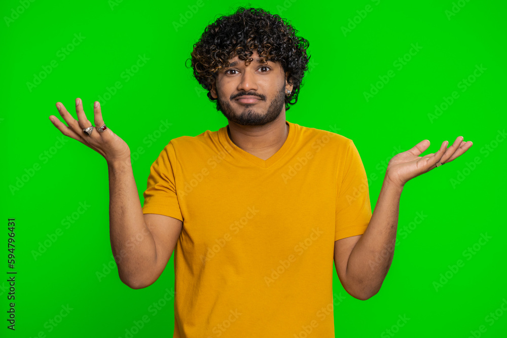 No idea, I dont know answer. Puzzled clueless uncertain indian handsome man raising hands in helpless gesture, embarrassed confused by difficult question. Confused one guy on chroma key background No idea, I dont know answer. Puzzled clueless uncertain indian handsome man raising hands in helpless gesture, embarrassed confused by difficult question. Confused one guy on chroma key background