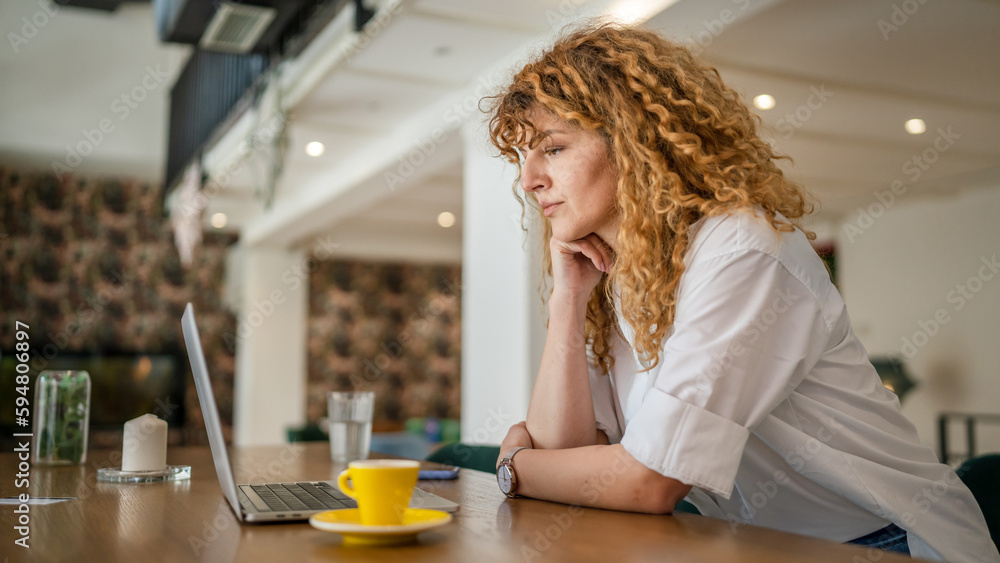 Woman use work on laptop from cafe happy smile adult caucasian Woman use work on laptop from cafe happy smile adult caucasian