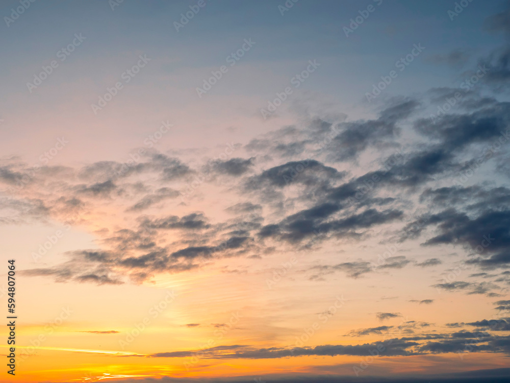 Stunning sun rise sky with clouds. Warm and cool color. Background for design and sky replacement.