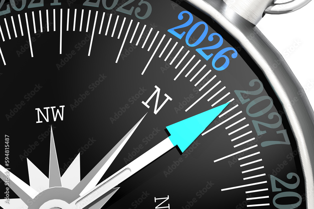 Metal compass with year 2026 on black surface Metal compass with year 2026 on black surface