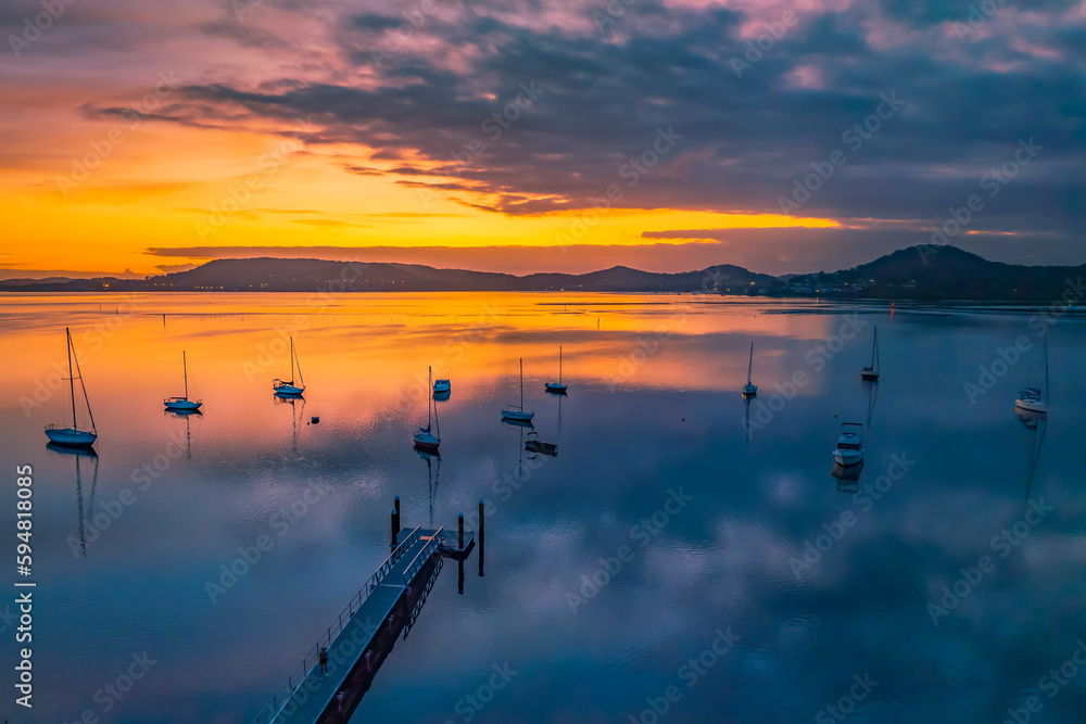 Aerial sunrise waterscape with boats and high cloud Aerial sunrise waterscape with boats and high cloud