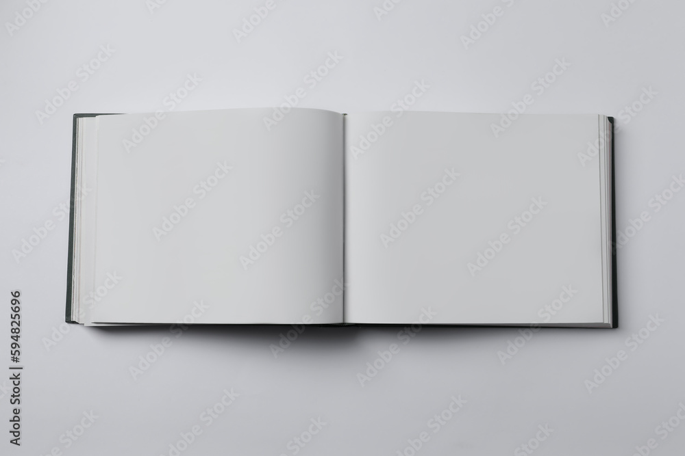 Open book on white background, top view Open book on white background, top view
