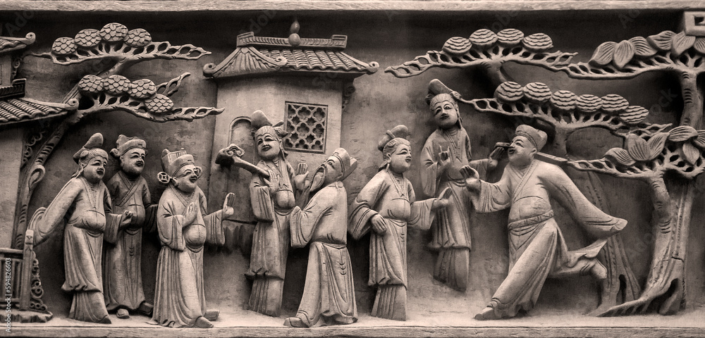 Close-up of wood carving patterns of ancient Chinese figures
