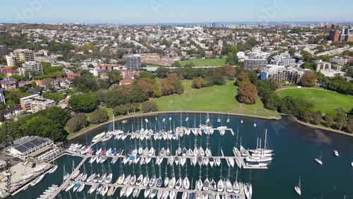 Aerial drone pullback reverse view of Rushcutters Bay in East Sydney, NSW Australia on a sunny day  photo