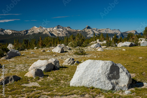 Large Boulder Sits in Grassy Field on the way to Ragged Peak © kellyvandellen