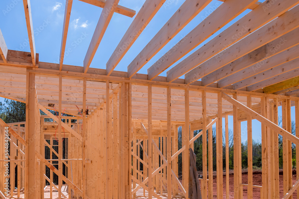 An enclosing beam supports framework of layout joists in newly constructed wooden structure. An enclosing beam supports framework of layout joists in newly constructed wooden structure.