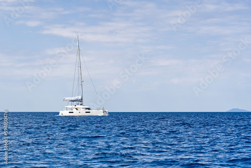 Yacht catamaran on the sea. Catamaran sailing on turquoise waters. Holiday or vacation at sea. Luxury yachts. summer