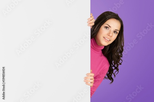 Positive young lady hold blank poster