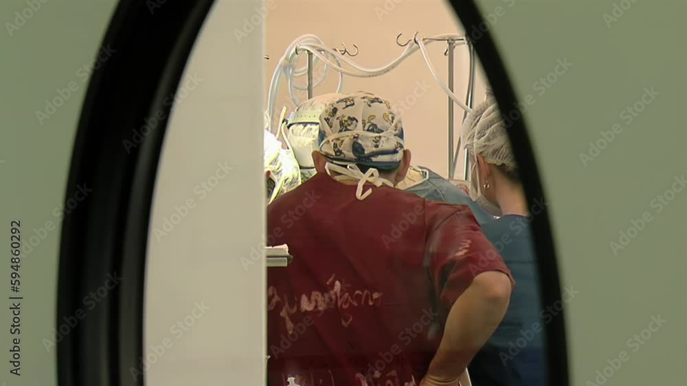 Surgical Team preparing for Surgery in Operating Room at Medical Center. Surgical Team preparing for Surgery in Operating Room at Medical Center.