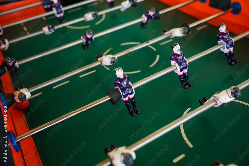A foosball table is a recreational game symbolizing entertainment, skill, and socializing. It represents teamwork, competition, and the joy of play, and is often associated with bar and culture A foosball table is a recreational game symbolizing entertainment, skill, and socializing. It represents teamwork, competition, and the joy of play, and is often associated with bar and culture